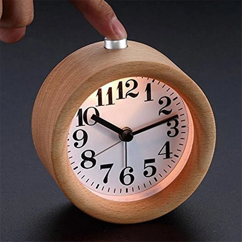 Solid beech wood analog alarm clock with silent snooze on a wooden bedside table