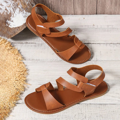 Women's flat sandals with velcro fastening and rubber soles in black, brown and colourful designs