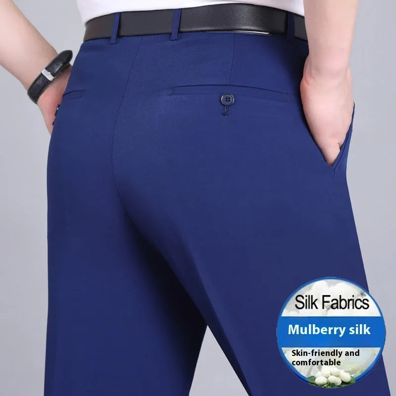 Man wearing dark blue straight-leg non-iron business trousers with a mulberry silk blend fabric.