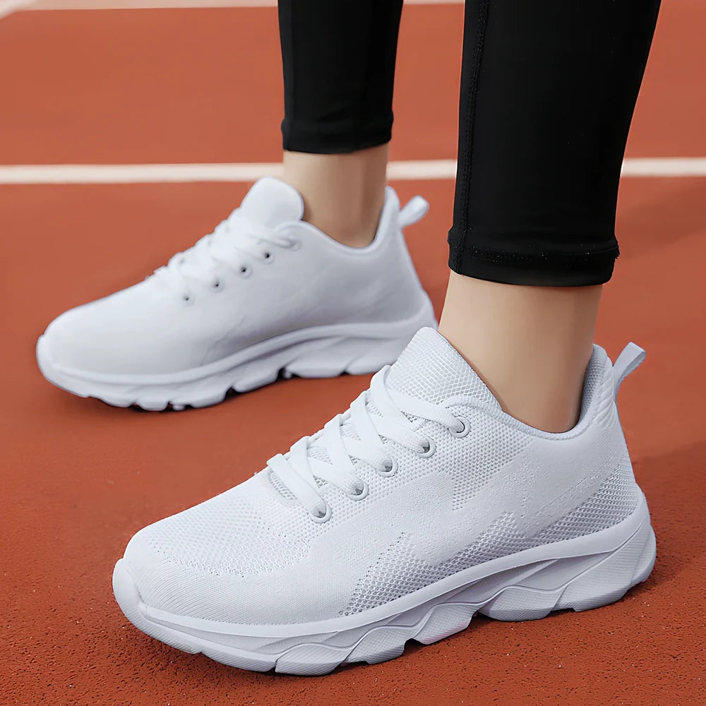 Women's black mesh running shoes with cross-strap and 3-5cm wedge heel, fabric upper with sewing details