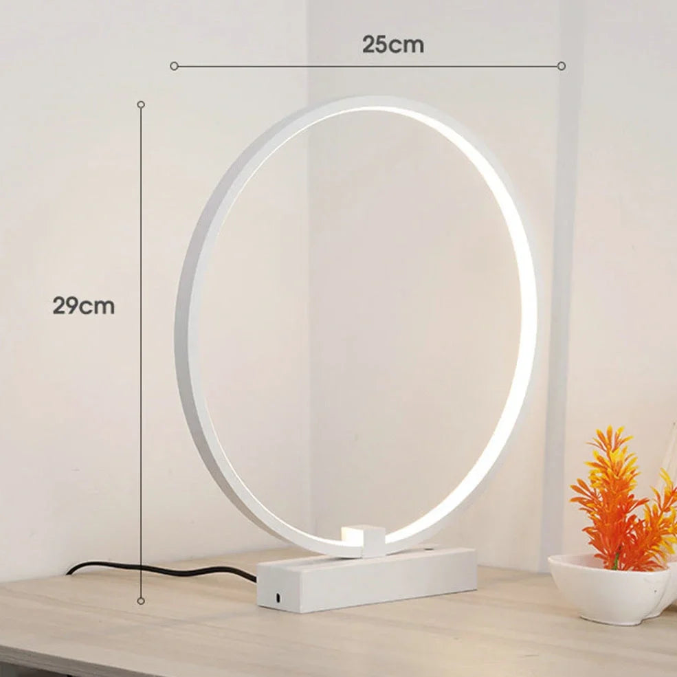 Modern 25cm diameter white LED bedside lamp with acrylic frame and iron base, emitting cool or warm white flicker-free light
