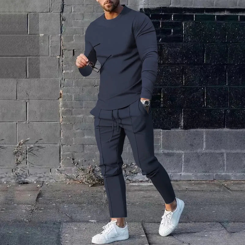 Men's solid colour two-piece lounge suit with long sleeve T-shirt and trousers in light grey.