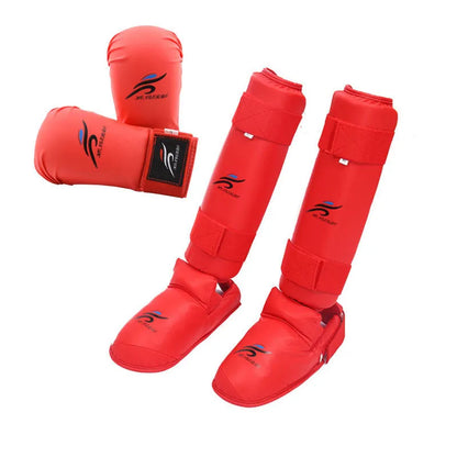 Red and blue karate taekwondo protective gear set with leg guards, helmet, and boxing gloves.