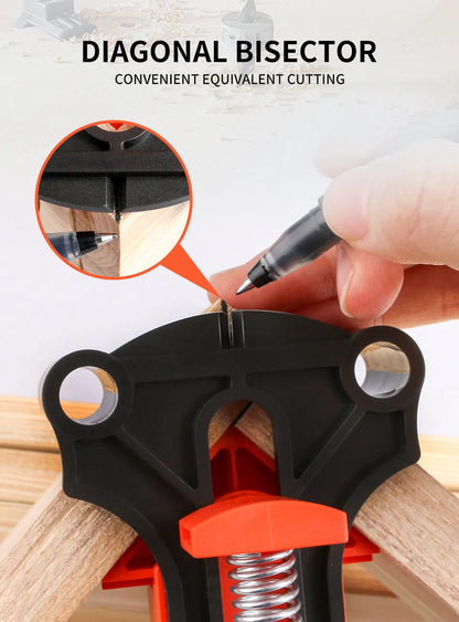 Four white plastic right angle clamps for woodworking and picture frame assembly on a workbench.