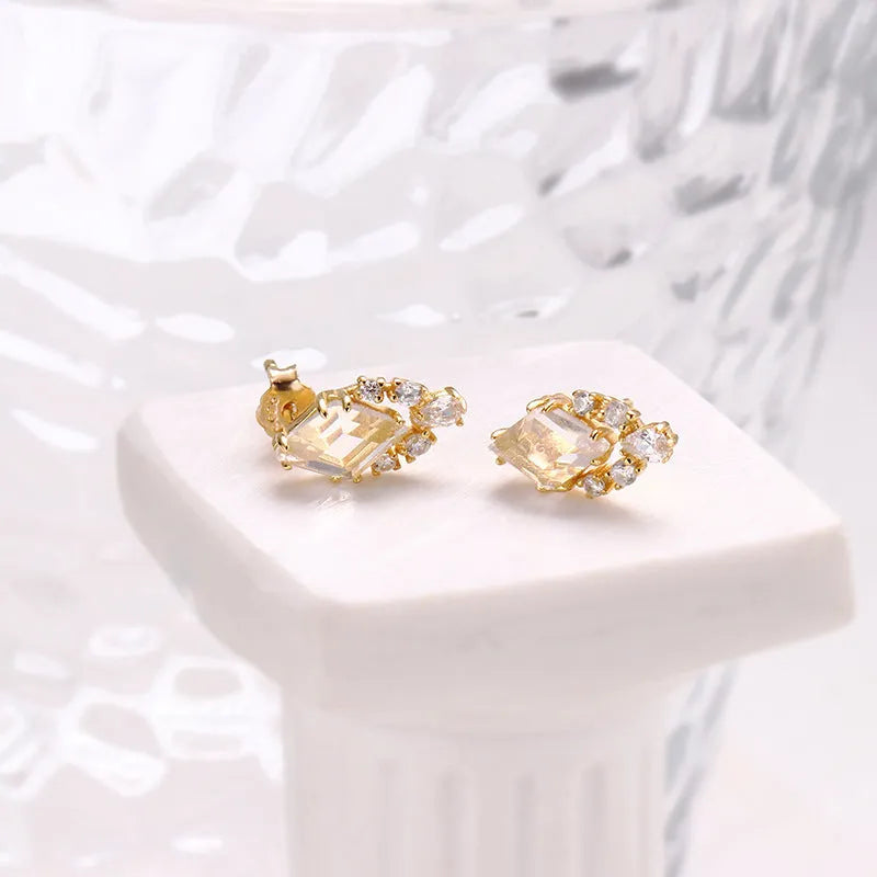 Geometric sterling silver ear studs with sweet white crystal stones