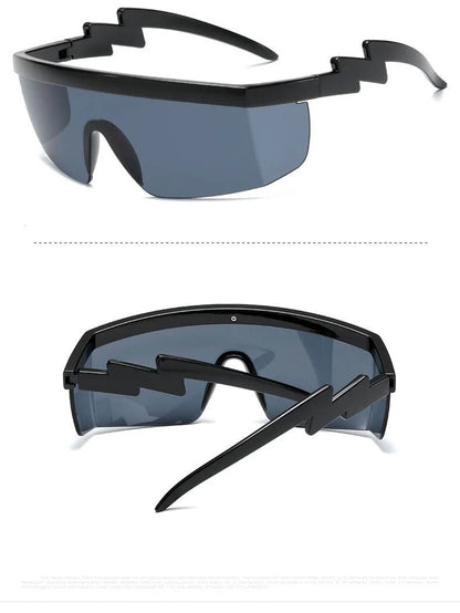 Black one-piece cycling sunglasses with blue polycarbonate lenses and lightning leg temples on a grey background.