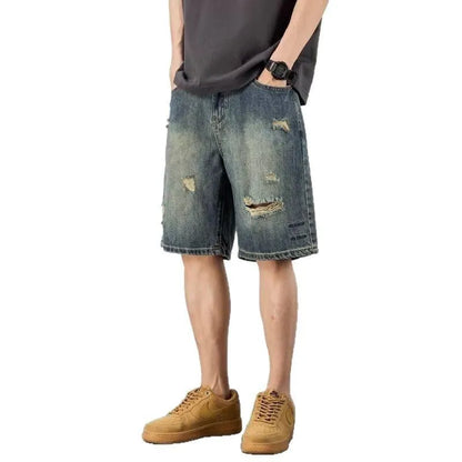Men's blue loose fit denim shorts with distressed holes and straight leg