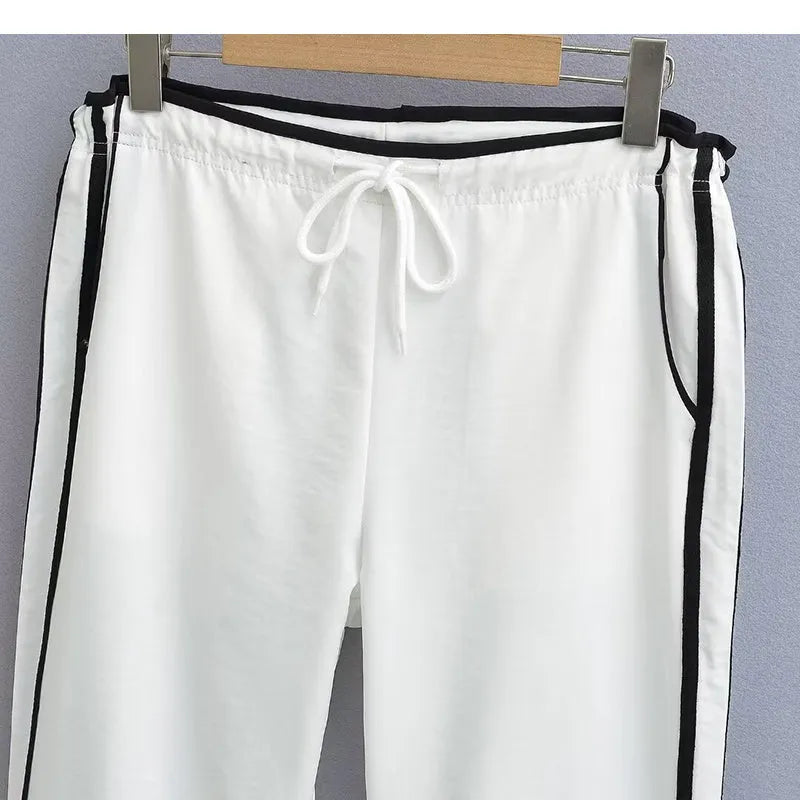 Women's navy blue straight-leg trousers with white contrast ribbon parallel bars pattern design
