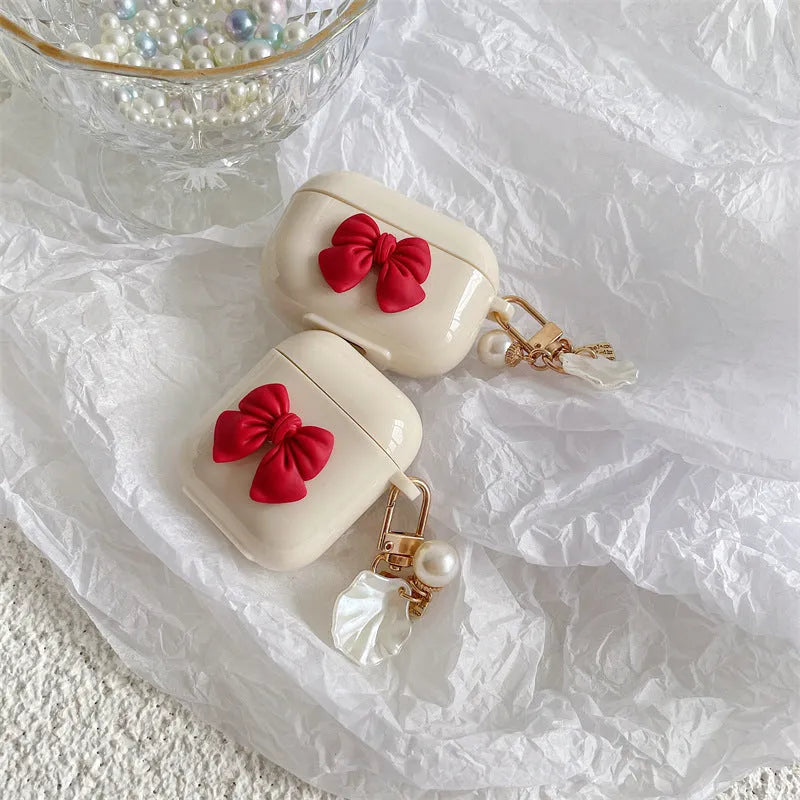 AirPods Pro Wireless Earphone Case with Beige Red Bow Shell Design and Clamshell Style Protective Sleeve Cover Made from Flexible TPU Material