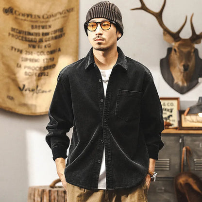 Men's red corduroy loose-fit shirt jacket with long sleeves, showing front view.