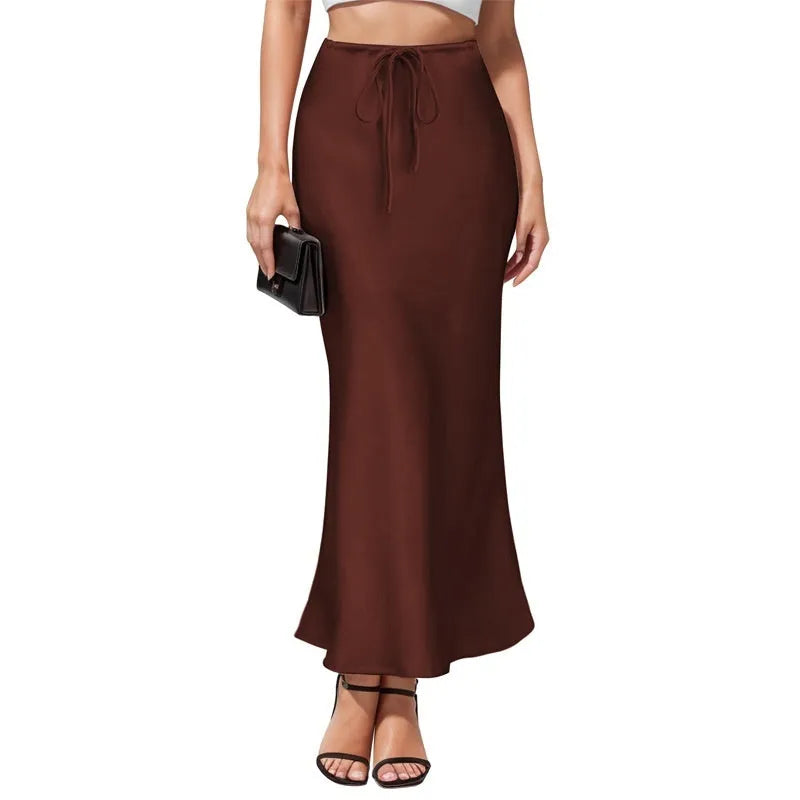 Asymmetric high waist acetate skirt with irregular stitching in multiple colour options.