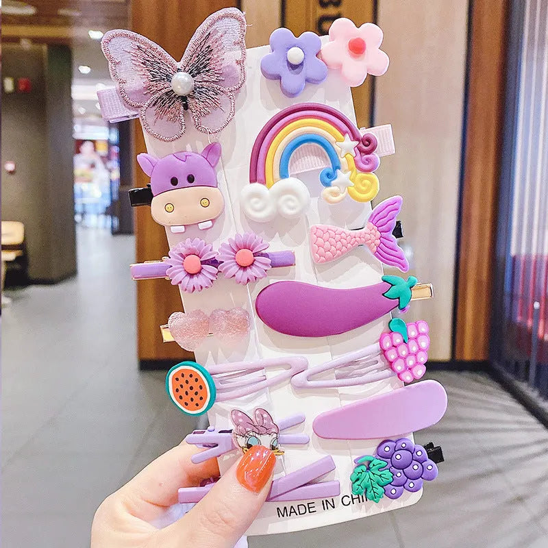 Assortment of colourful toddler hair clips and barrettes with candy, rainbow, fruit, and butterfly designs