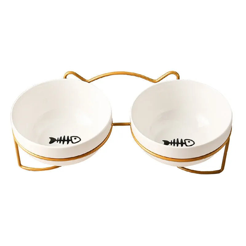 White ceramic pet bowl with cat paw print in a black iron stand with cat ear details