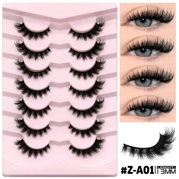 Box containing six pairs of black artificial fibre false eyelashes with different styles and a tube of clear lash glue.