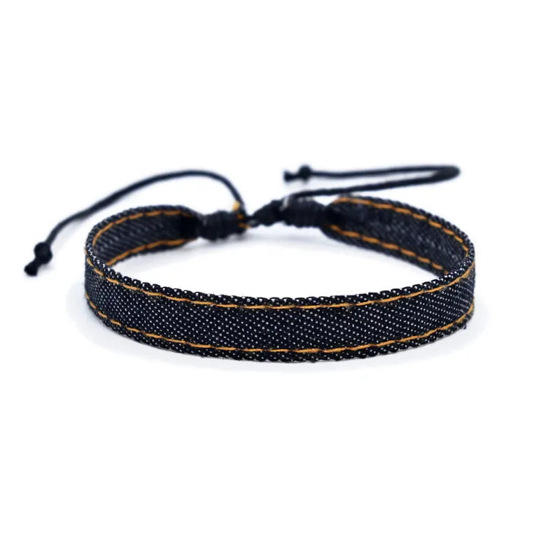 National style denim fabric bracelet carrying strap showing mixed material construction and wristband design