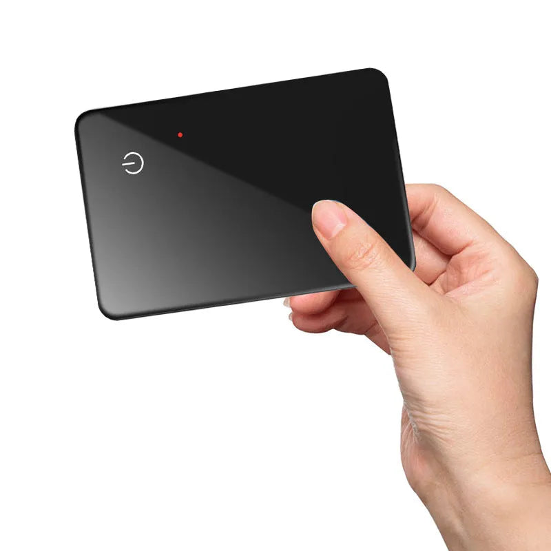 Black card-sized pet tracker with wireless charging and a hanging hole for collar attachment