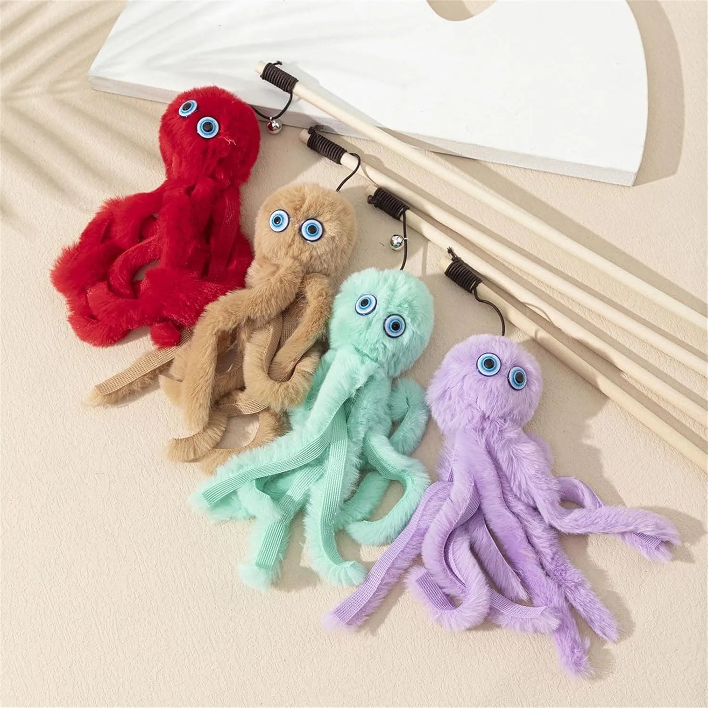 Octopus-themed furry cat toy attached to a long stick, shown in pink colour.