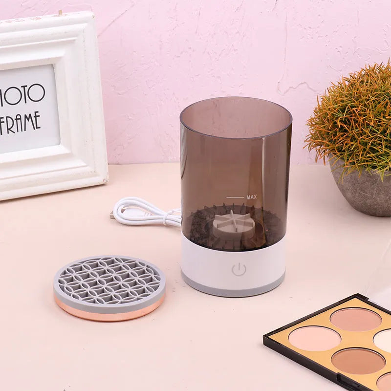 Grey and white portable electric makeup brush cleaner machine with USB charging cable