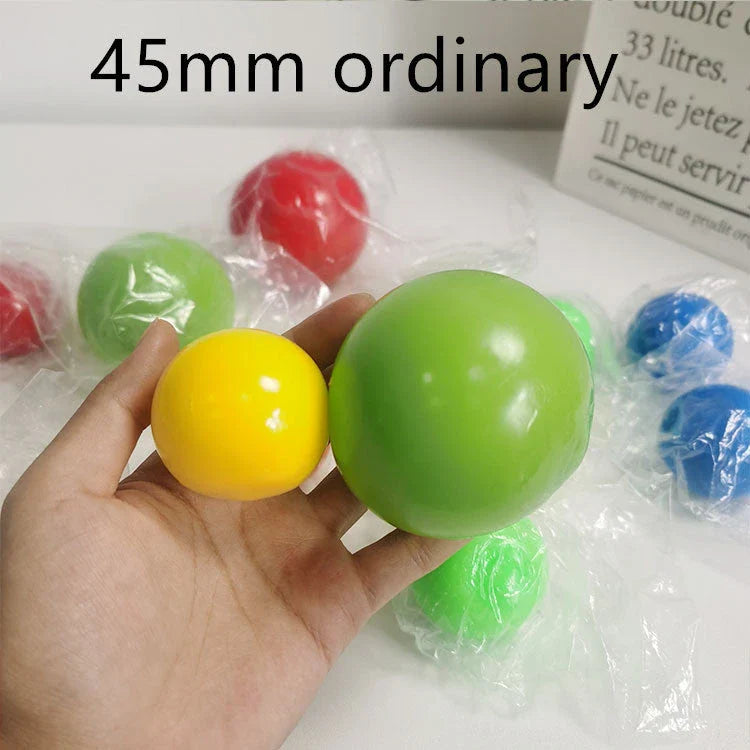 Colorful, luminous stress relief balls with a sticky surface for bouncing, squeezing, and sticking to surfaces