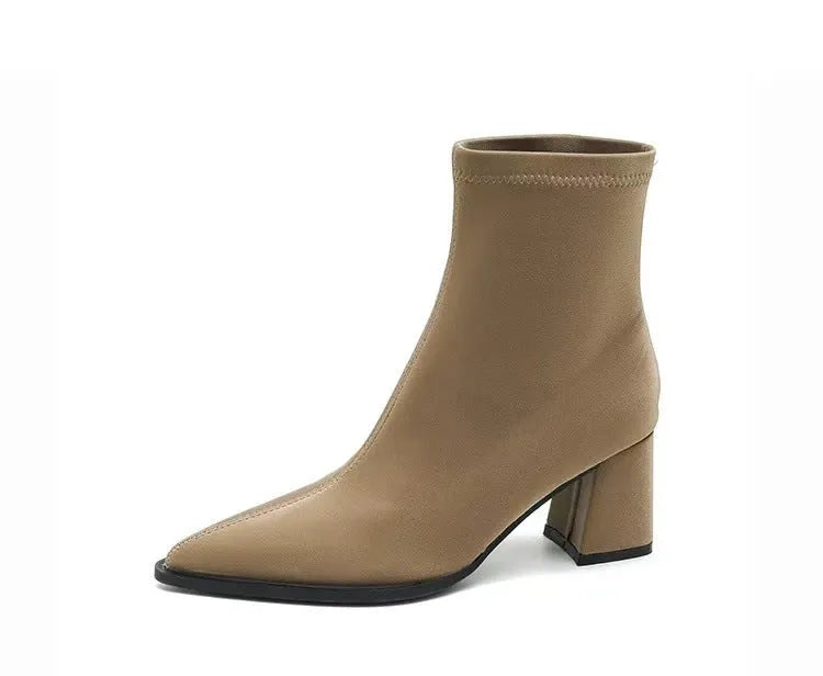 Women's khaki stretch suedette pointed toe ankle boots with a mid block heel on a white background.