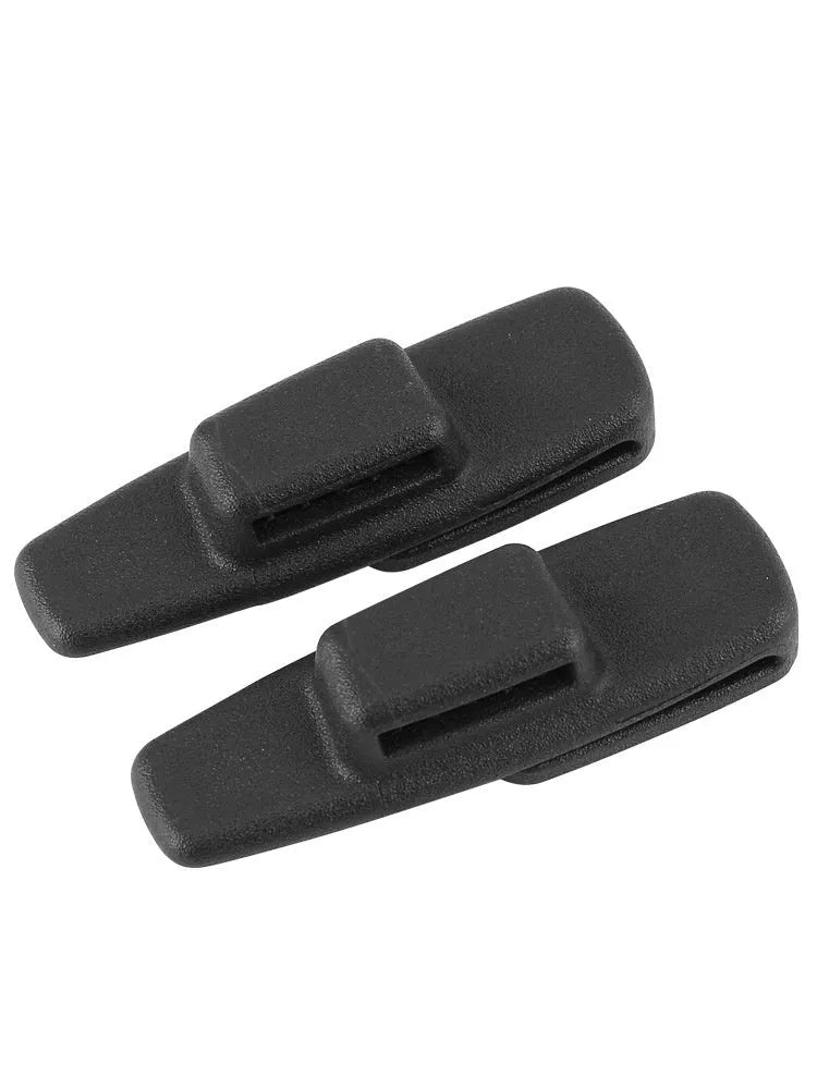 Two black ABS plastic car seat belt stopper clips in clear OPP packaging
