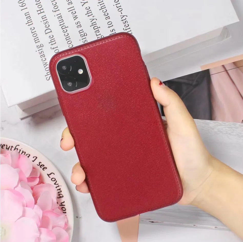 Leather-textured TPU phone case for iPhone in black, brown, navy blue, or wine red colour options.
