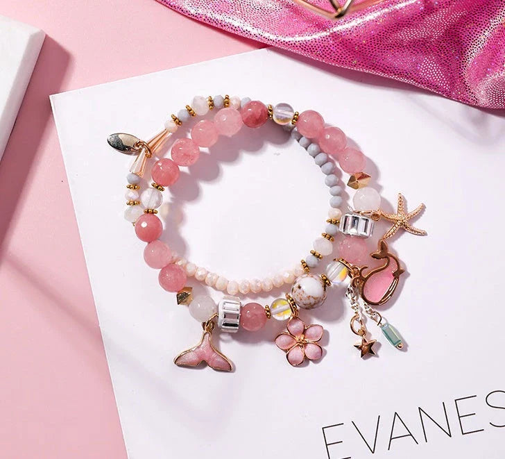Whale tail bracelet with retro flower and starfish accents, a charming nautical accessory for UK fashionistas