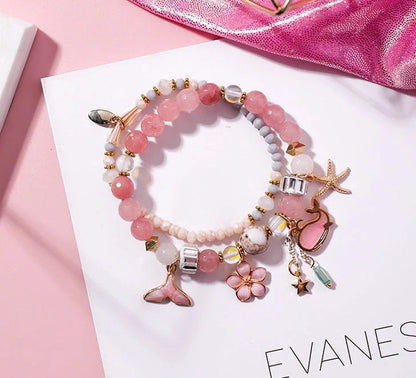 Whale tail bracelet with retro flower and starfish accents, a charming nautical accessory for UK fashionistas