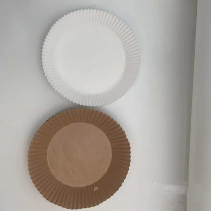Disposable air fryer liners made from high-quality parchment paper, designed to keep your air fryer clean and your meals healthy