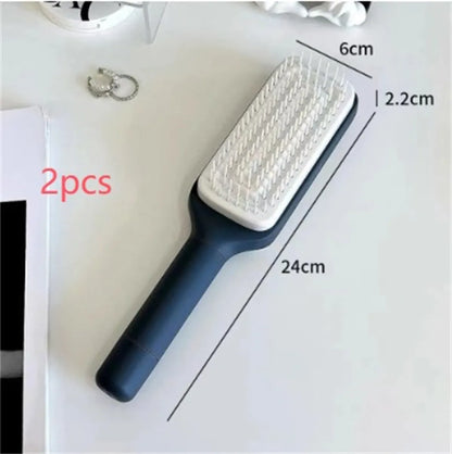 Purple and grey self-cleaning hair brush with rotating handle for easy debris removal