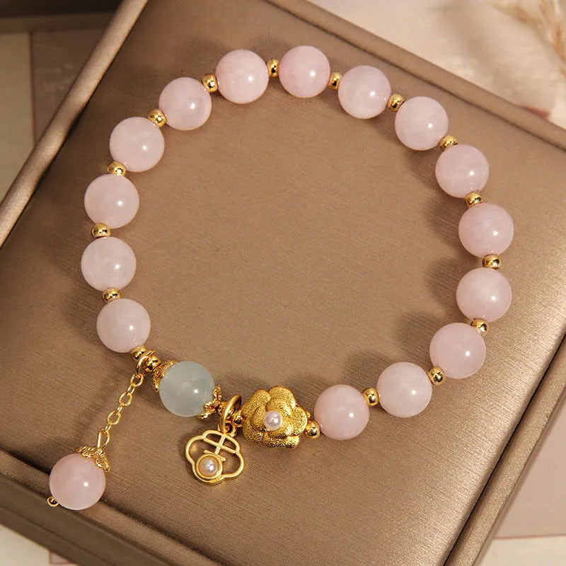 Women's pink crystal flower bracelet with adjustable sizing and refined grace floral design