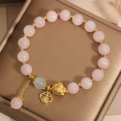 Women's pink crystal flower bracelet with adjustable sizing and refined grace floral design