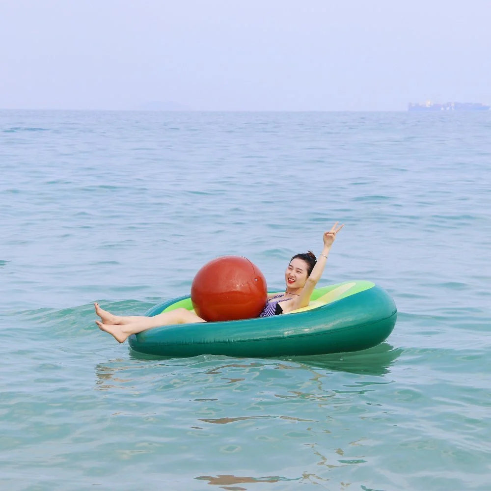 Giant avocado-shaped inflatable pool float for swimming and parties