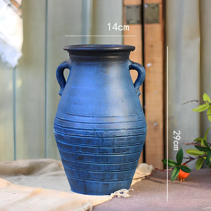 Ceramic mosaic vase with dried flower arrangement, handcrafted surface detailing