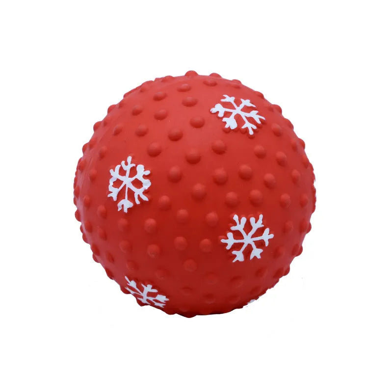 Red and green Christmas snowflake print dog chew ball with air vents, approx 7cm diameter.