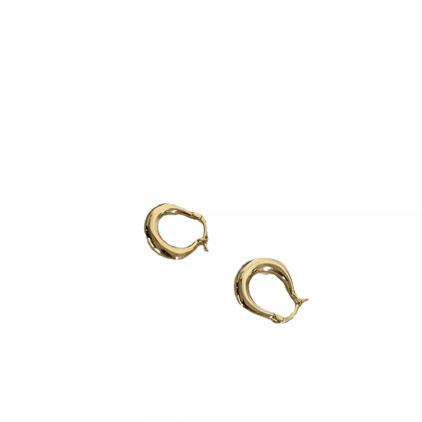Small fat circle ear clip bracelet in white gold and yellow gold colours