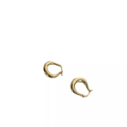 Small fat circle ear clip bracelet in white gold and yellow gold colours