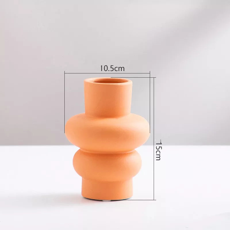 Nordic minimalist ceramic vase with glazed finish in blue, yellow, and orange options