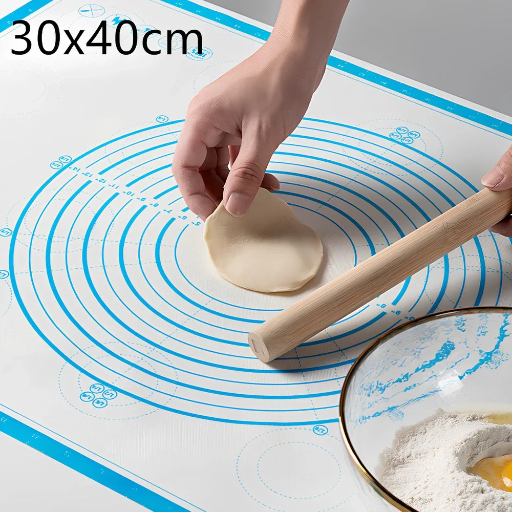 40x60cm black silicone baking mat with measurement guides on kitchen counter