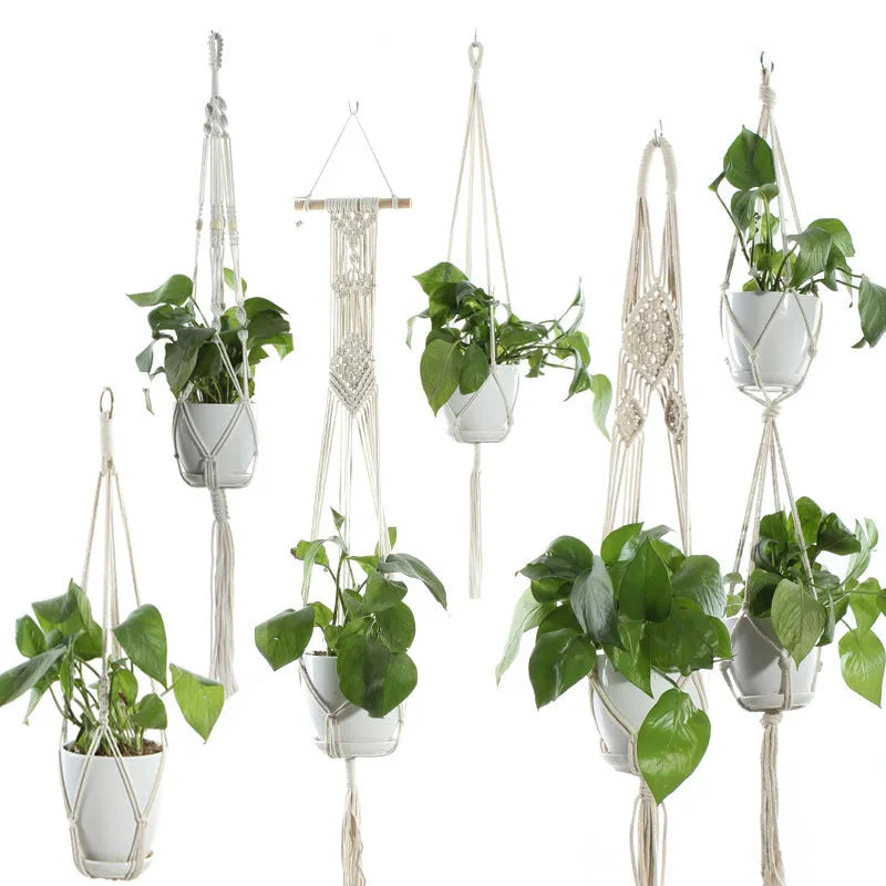 Handmade beige cotton rope net bag holding a plant pot, showing its textured sling design.