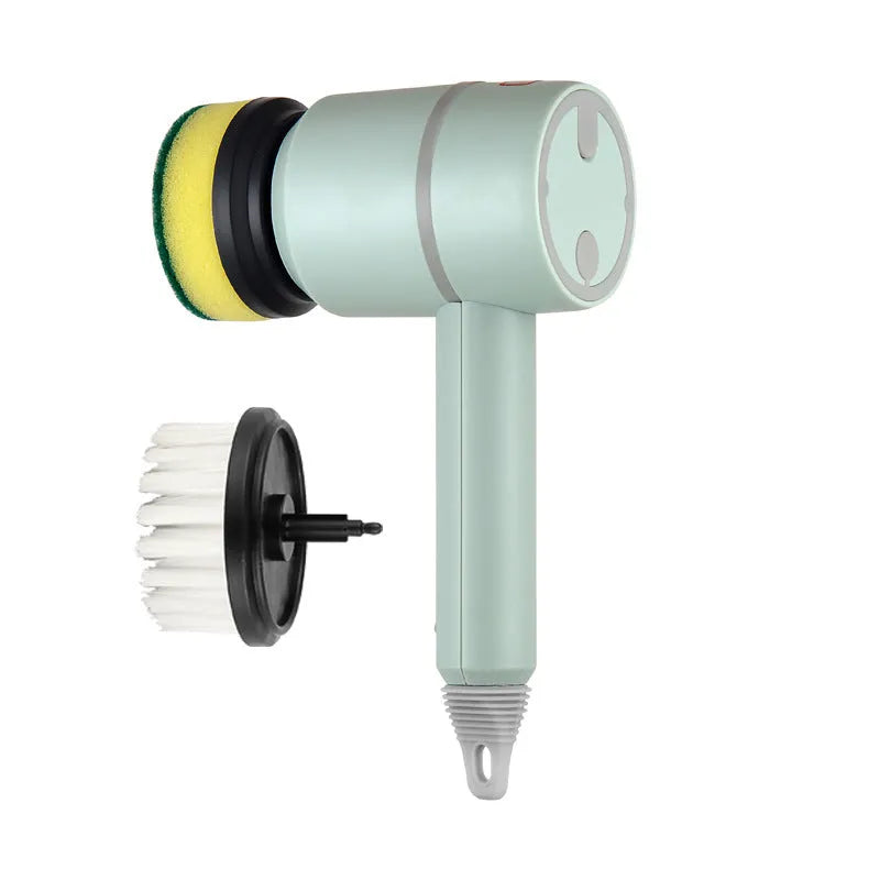 Green electric cleaning brush with multiple brush heads on a kitchen worktop.