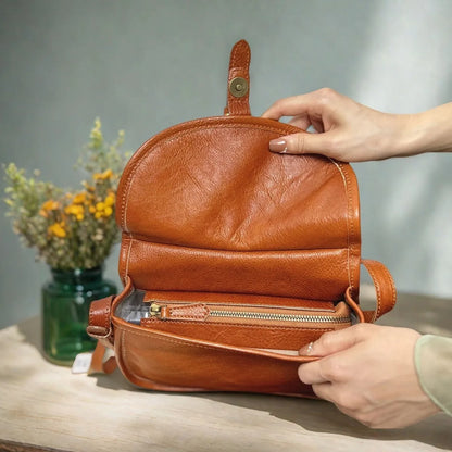 Genuine leather retro messenger bag with crossbody strap and flap closure in coffee colour