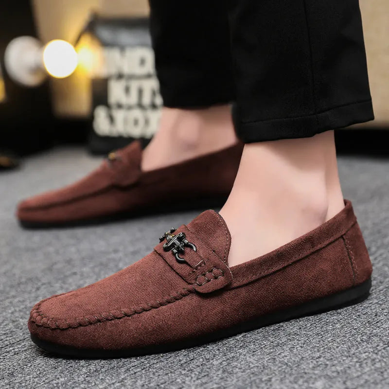 Men's black waterproof slip-on loafers with round toe and low heel on a rubber sole.