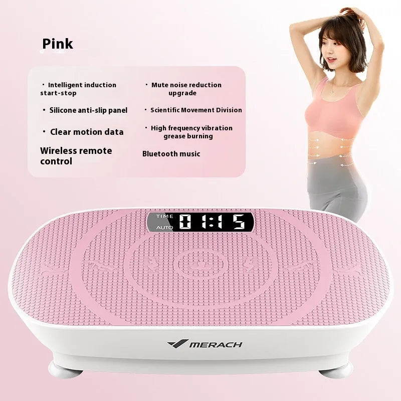 Grey portable vibration plate on a wooden floor, showing its slim 16cm profile and textured platform surface.
