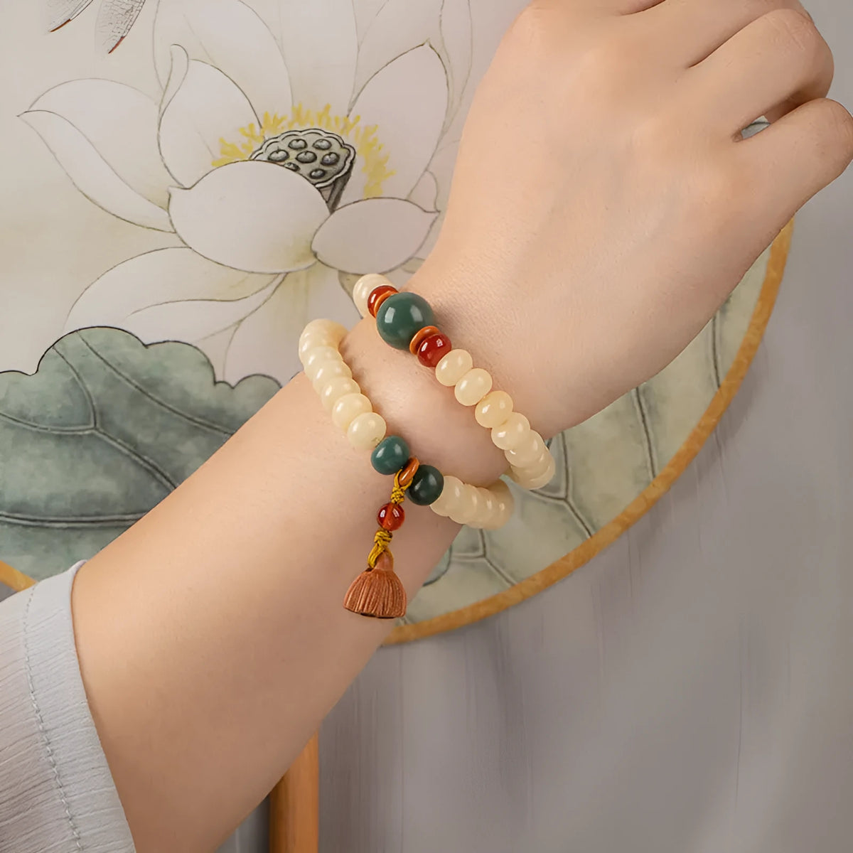 Cream-coloured wooden Bodhi root bracelet with flat round beads on 15-20cm wrist