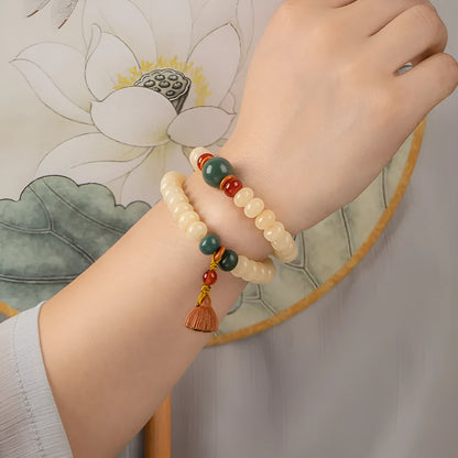 Cream-coloured wooden Bodhi root bracelet with flat round beads on 15-20cm wrist