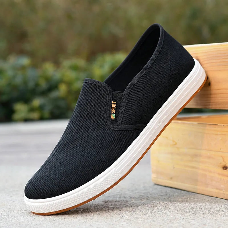Men's low-top canvas cloth shoes with slip-on design and composite sole in black colour
