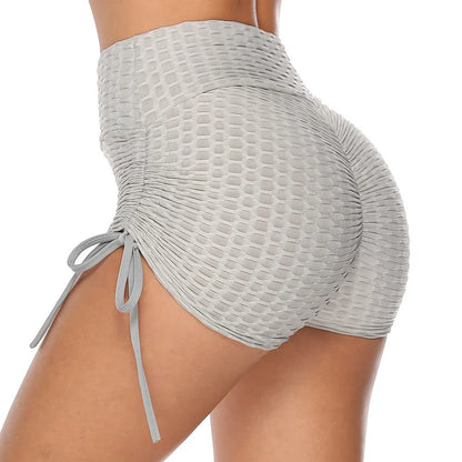 Curve-enhancing workout shorts in a variety of vibrant colors with a drawstring waistband for a customized fit.