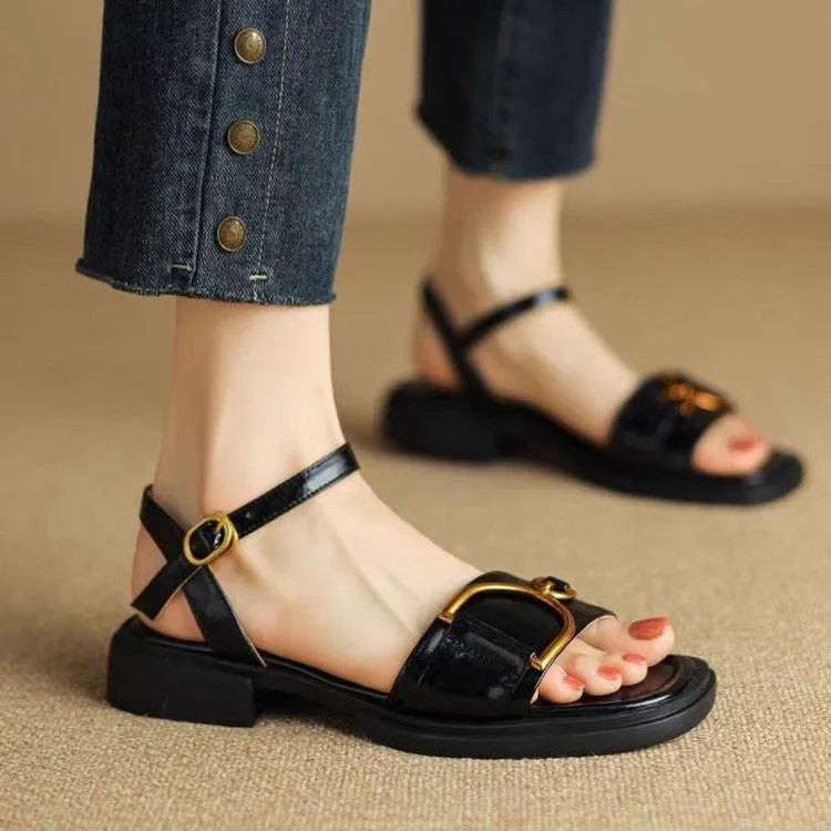 Women's black thick-soled casual sandals with round toe and a single button fastening across the instep.