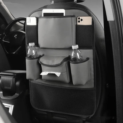 Genuine leather car seat back storage bag hanging from a headrest, shown in brown colour.
